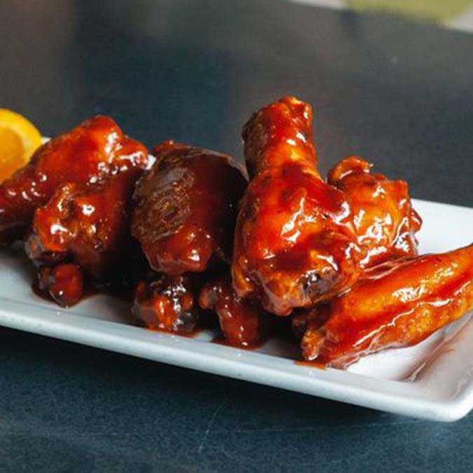 Barbecue chicken wings at Jacque B's Kitchen & Cocktails, perfect with your favorite drink.