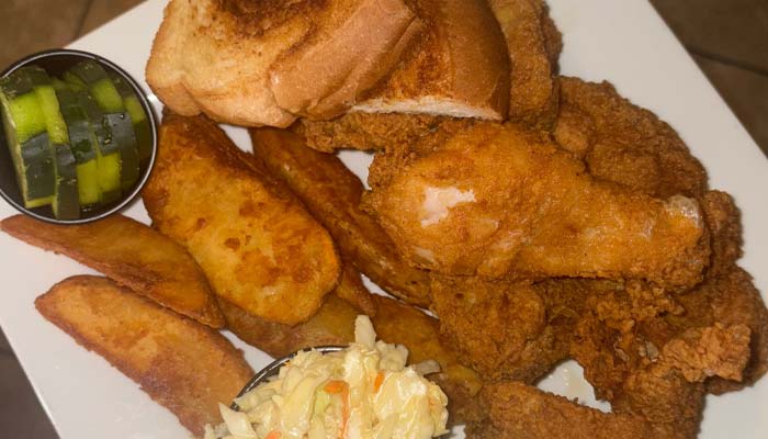 Fried chicken, potato wedges, coleslaw, and toast served at our Bar & Grill restaurant.