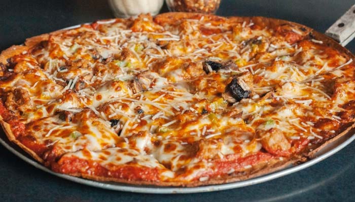 A Montrose Minnesota food favorite: baked pizza with cheese, mushrooms, and green peppers.
